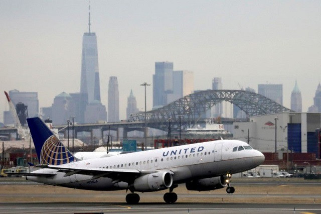 a united airlines passenger jet takes off with new york city as a backdrop at newark liberty international airport new jersey us december 6 2019 photo reuters