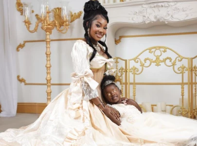 summer walker sparks spirituality debate after covering daughter s eyes in new photoshoot