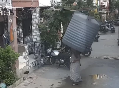 watch woman survives water tank falling on her head in india