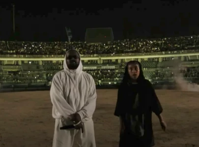 north west joins kanye west on stage in south korea as kim kardashian expresses concerns