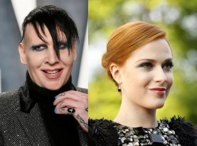 why did marilyn manson sue evan rachel wood shock rocker drops defamation lawsuit
