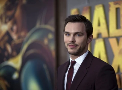 nicholas hoult says it felt warm to be held by superman star david corenswet