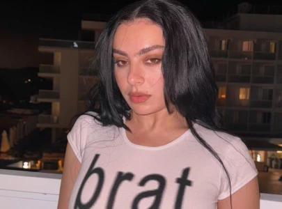 charli xcx faces backlash over flashing lights at surprise times square performance