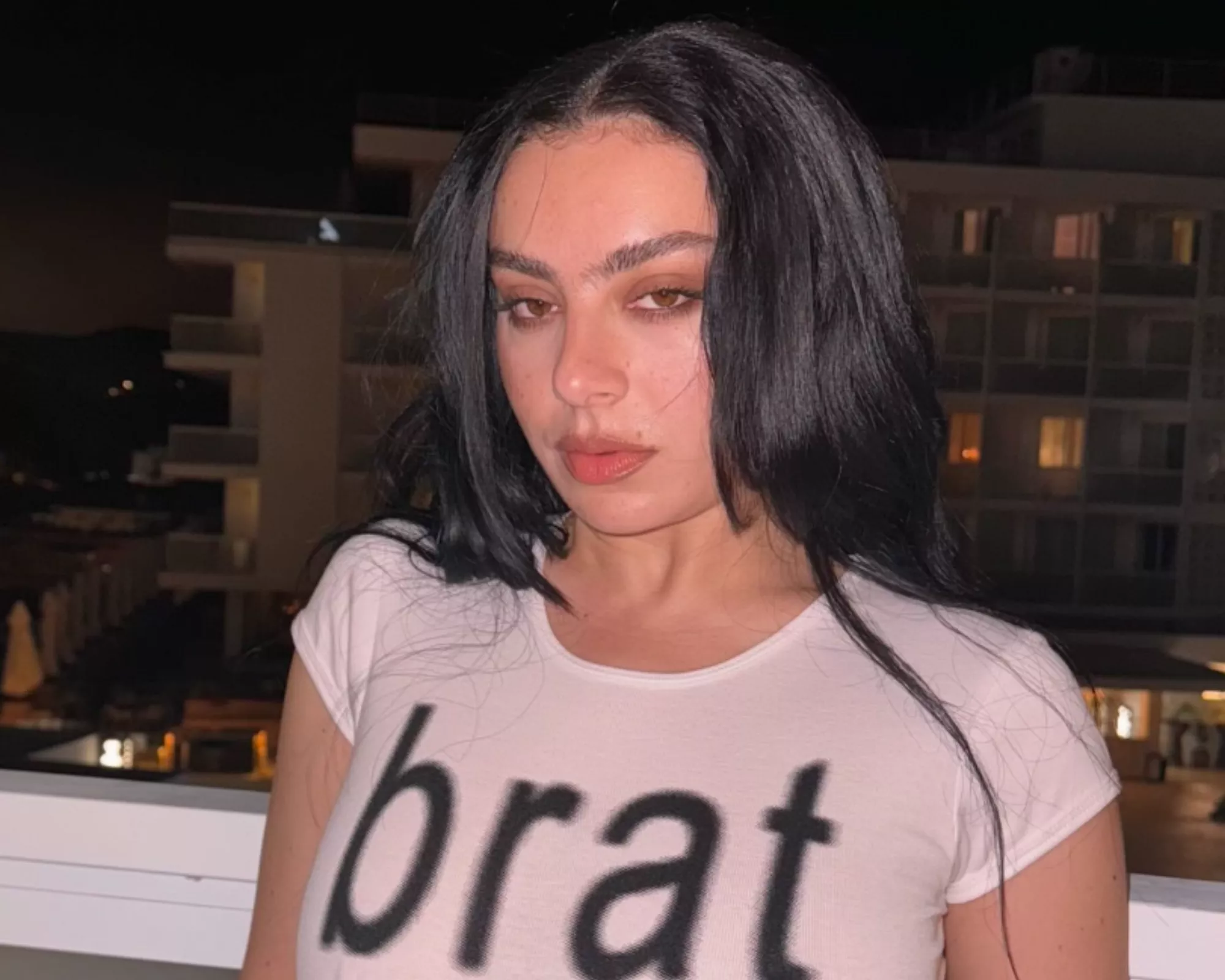 charli xcx faces backlash over flashing lights at surprise times square performance