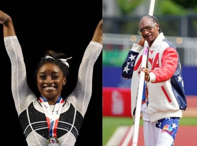 simone biles celebrates her father s 75th birthday at the olympics with a gift from snoop dogg