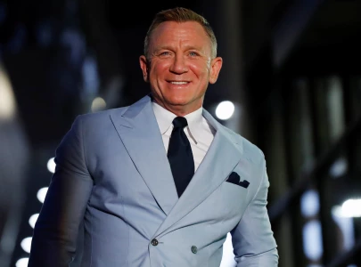 daniel craig donates iconic james bond motorbikes to support rnli s 200th anniversary