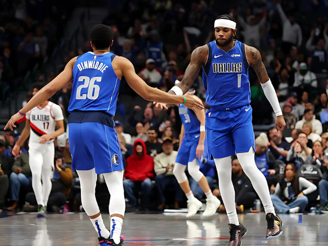 hardy and dinwiddie celebrate a 3 pointer during the first quarter