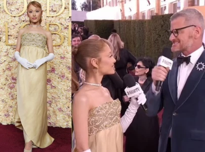 ariana grande caught up in awkward exchange with red carpet host at golden globes 2025