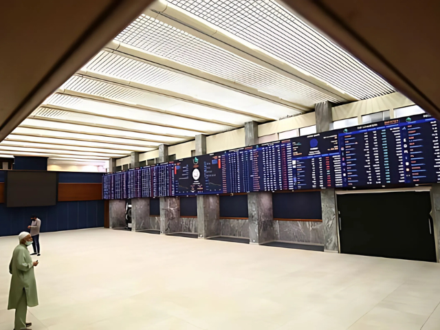 a stockbroker monitors the share prices during a trading session at the pakistan stock exchange psx in karachi on may 16 2022 afp