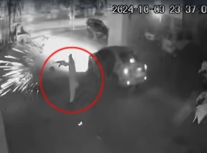 watch firing targets car showroom in rawalpindi