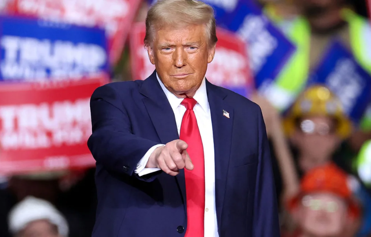 Former President Donald Trump gestures during a campaign rally in Pittsburgh, Pennsylvania on Monday, November 4. Charly Triballeau/AFP