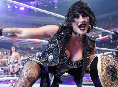 rhea ripley wins women s world title celebrates with legend during wwe raw netflix debut