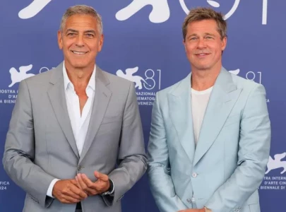 george clooney and brad pitt embraced age jokes in new film wolfs says director jon watts