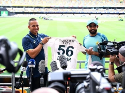 babar azam donates jersey to usman khawaja s foundation babar azam donates jersey to usman khawaja s foundation