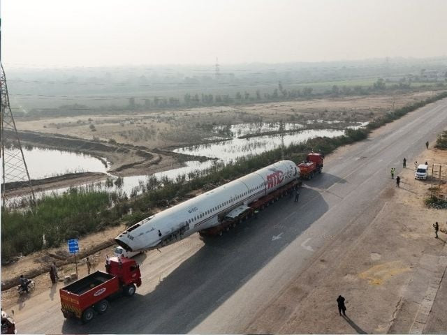 watch crash landed plane being transported by road to hyderabad watch crash landed plane being transported by road to hyderabad