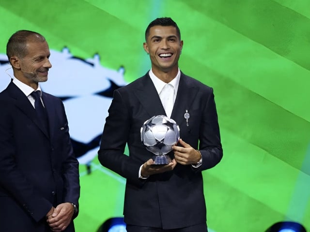 uefa president aleksander ceferin with cristiano ronaldo as he receives the all time top scorer of the champions league award   reuters file