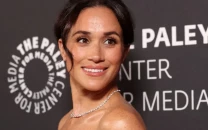 meghan markle makes first paris fashion week debut