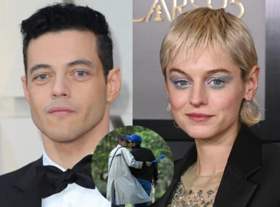 rami malek discusses relationship with emma corrin calls them fascinating