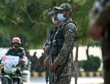 paramilitary soldiers stand guard outside the rawalpindi cricket stadium in rawalpindi on september 17 2021 after new zealand postponed a series of one day international odi cricket matches against pakistan over security concerns afp