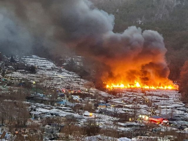 smoke rises from a fire at guryong village the last slum in the glitzy gangnam district in seoul south korea january 20 2023 photo reuters