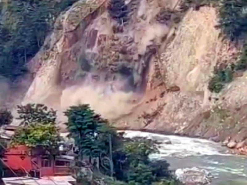 dust rises amid landslide into a nullah of the river kunhar near mahandri area of balakot the landslide has directly affected more than 40 families in close vicinity the local population is concerned that it may create a new lake in the river posing a serious threat to lives and properties photo screengrab