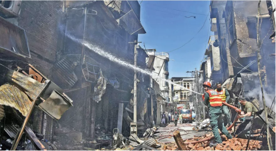 burnt to ashes the cooling process continues in the fire hit urdu bazaar as smoke rises from the shops gutted in the blaze burnt to ashes the cooling process continues in the fire hit urdu bazaar as smoke rises from the shops gutted in the blaze