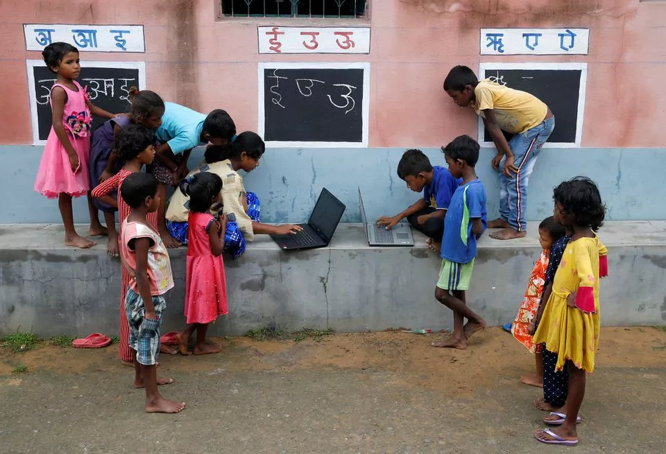 in remote indian village teacher turns walls into blackboards to close school gap in remote indian village teacher turns walls into blackboards to close school gap