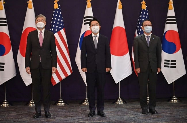 sung kim l us special representative for north korea noh kyu duk c south korea s special representative for korean peninsula peace and security affairs and takehiro funakoshi r director general of the asian and oceanian affairs bureau of the ministry of foreign affairs of japan pose for a photo during their trilateral meeting at a hotel in seoul south korea june 21 2021 photo reuters