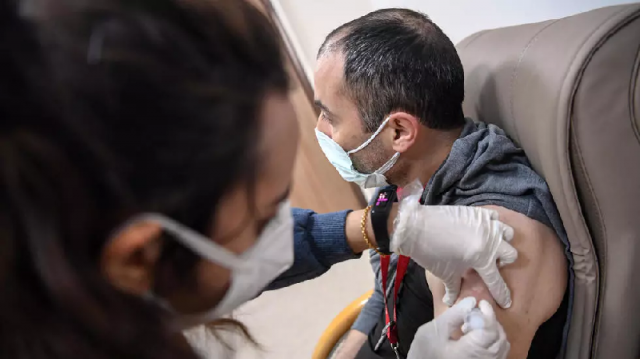 a medical worker receives an injection of the chinese sinovac vaccine at an istanbul hospital photo afp