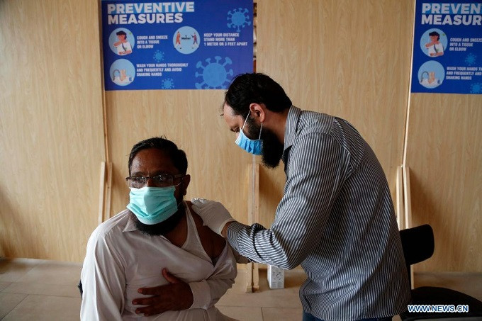 a man receives a dose of the chinese covid 19 vaccine at a vaccination center in islamabad capital of pakistan on july 13 2021 xinhua ahmad kamal