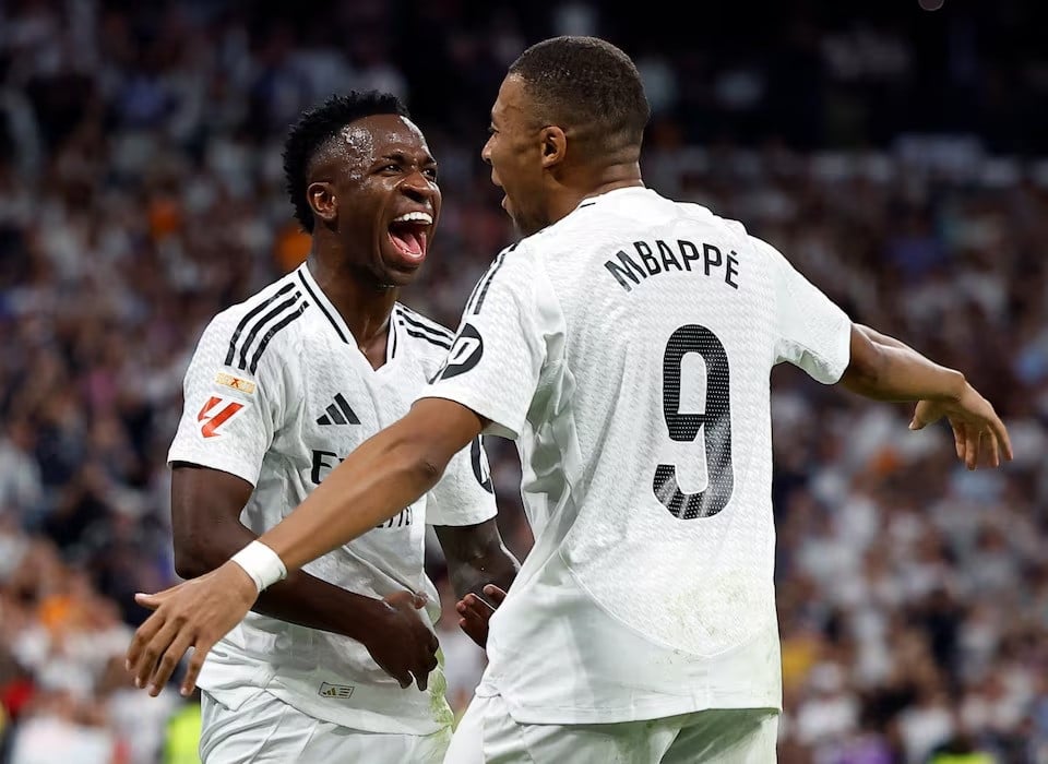 real madrid s vinicius junior celebrates scoring their third goal with kylian mbappe during laliga match against espanyol at santiago bernabeu madrid spain on september 21 2024 photo reuters