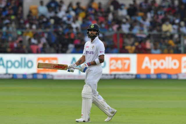 kohli was at first slip in the final session of the second day of the pink ball test against sri lanka when three young men ran on the field and attempted to embrace the player photo afp kohli was at first slip in the final session of the second day of the pink ball test against sri lanka when three young men ran on the field and attempted to embrace the player photo afp