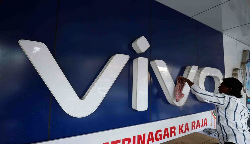 a man cleans the logo of a chinese smartphone brand vivo outside a store in ahmedabad india october 10 2023 photo reuters