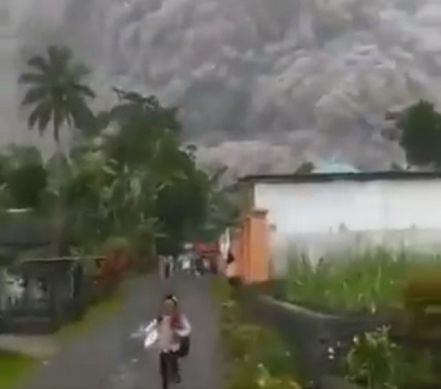 videos shared on social media showed local residents running as towering smoke and ash blanketed nearby villages video screengrab