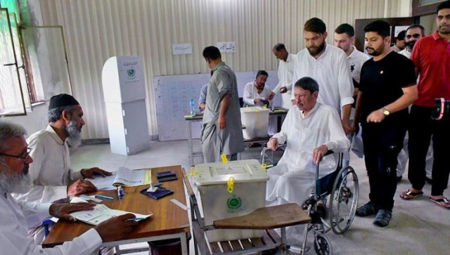 a senior citizen on a wheelchair arrives to cast their vote during by elections on july 17 2022 photo app a senior citizen on a wheelchair arrives to cast their vote during by elections on july 17 2022 photo app
