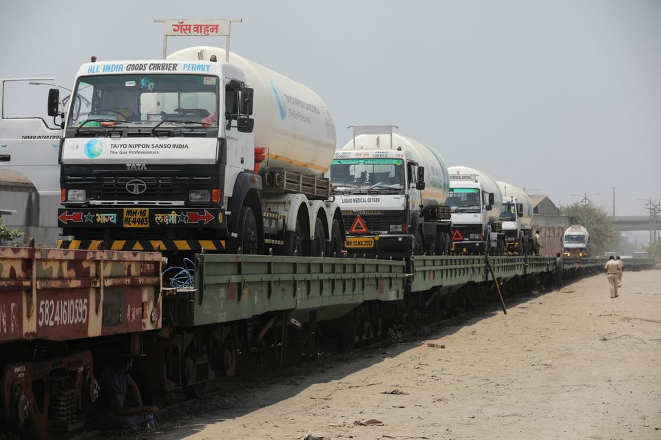 Empty cryogenic tankers are seen onboard the bogie open military new (BOMN) wagon before being transported to a Liquid Medical Oxygen (LMO) plant from another state for refilling with liquid oxygen, amidst the spread of the coronavirus disease (COVID-19), on the outskirts of Mumbai, India, April 19, 2021. REUTERS