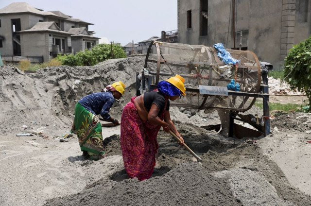 labourers work at a construction site on a hot summer day in noida india may 12 2022 reuters