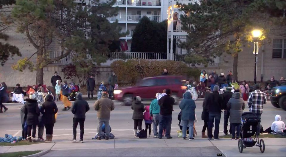 a red suv speeds past attendees moments before plowing into a crowd at a christmas parade in waukesha wisconsin u s in this still image taken from a november 21 2021 social media video reuters