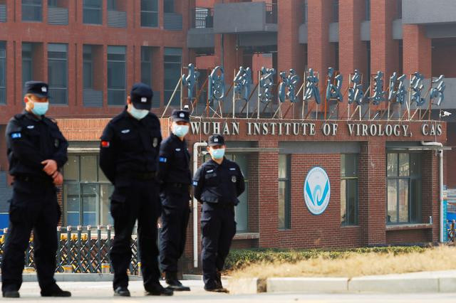 security personnel keep watch outside wuhan institute of virology during the visit by the world health organisation who team tasked with investigating the origins of the coronavirus disease covid 19 in wuhan hubei province china february 3 2021 photo reuters security personnel keep watch outside wuhan institute of virology during the visit by the world health organisation who team tasked with investigating the origins of the coronavirus disease covid 19 in wuhan hubei province china february 3 2021 photo reuters