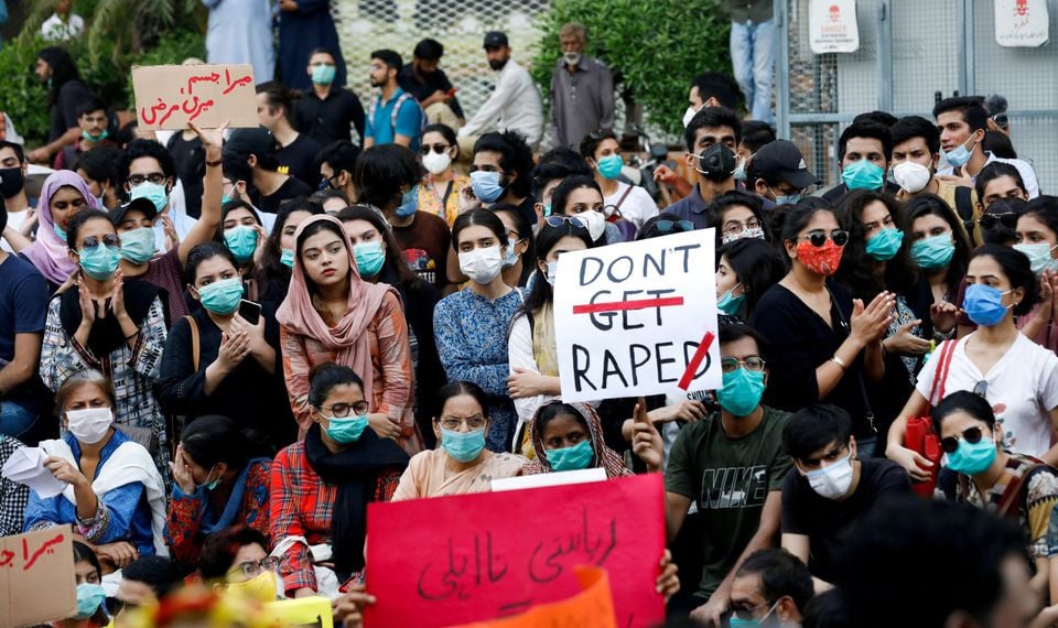 people carry signs against a gang rape that occurred along a highway and to condemn violence against women and girls during a protest in karachi pakistan september 12 2020 photo reuters