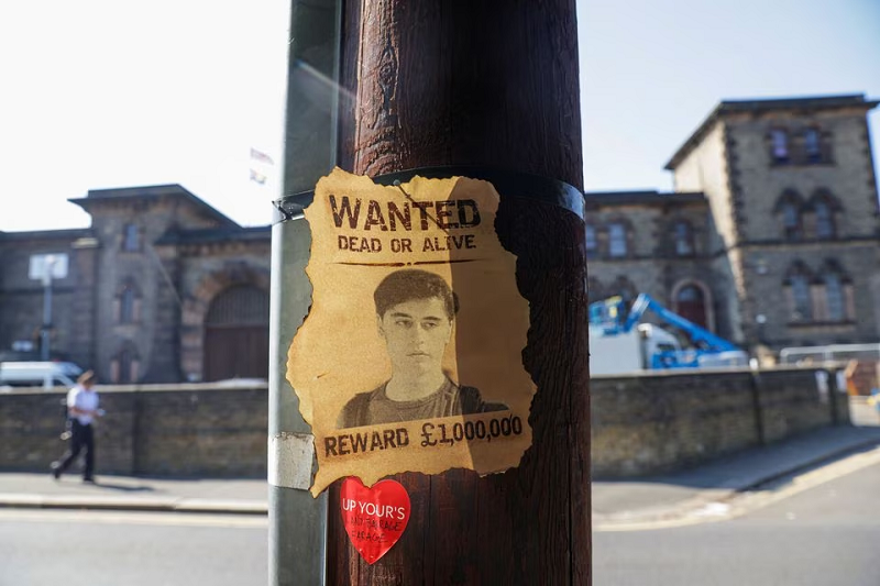 a wanted sign featuring daniel abed khalife a former soldier who is suspected of terrorism offences is displayed near wandsworth prison which he escaped from in london britain september 7 2023 photo reuters