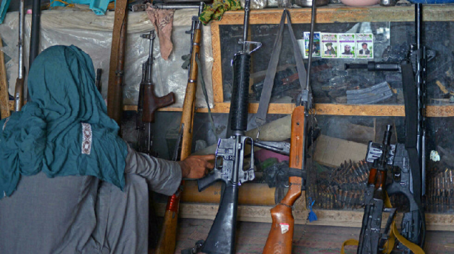 weapons dealers in panjwai kandahar province are flush with inventory after the taliban takeover of afghanistan photo afp weapons dealers in panjwai kandahar province are flush with inventory after the taliban takeover of afghanistan photo afp