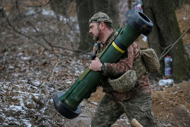 a ukrainian service member holds a javelin missile system at a position on the front line in the north kyiv region ukraine march 13 2022 photo reuters