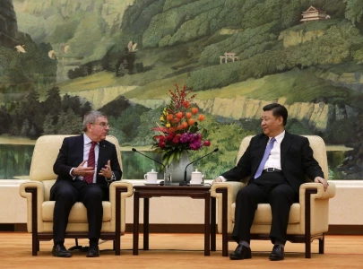 china s president xi meets ioc chief bach