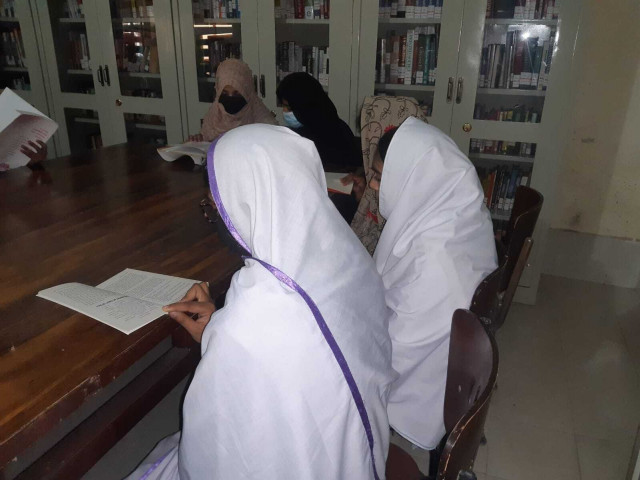 readers engrossed in books at a library in larkana photo express readers engrossed in books at a library in larkana photo express