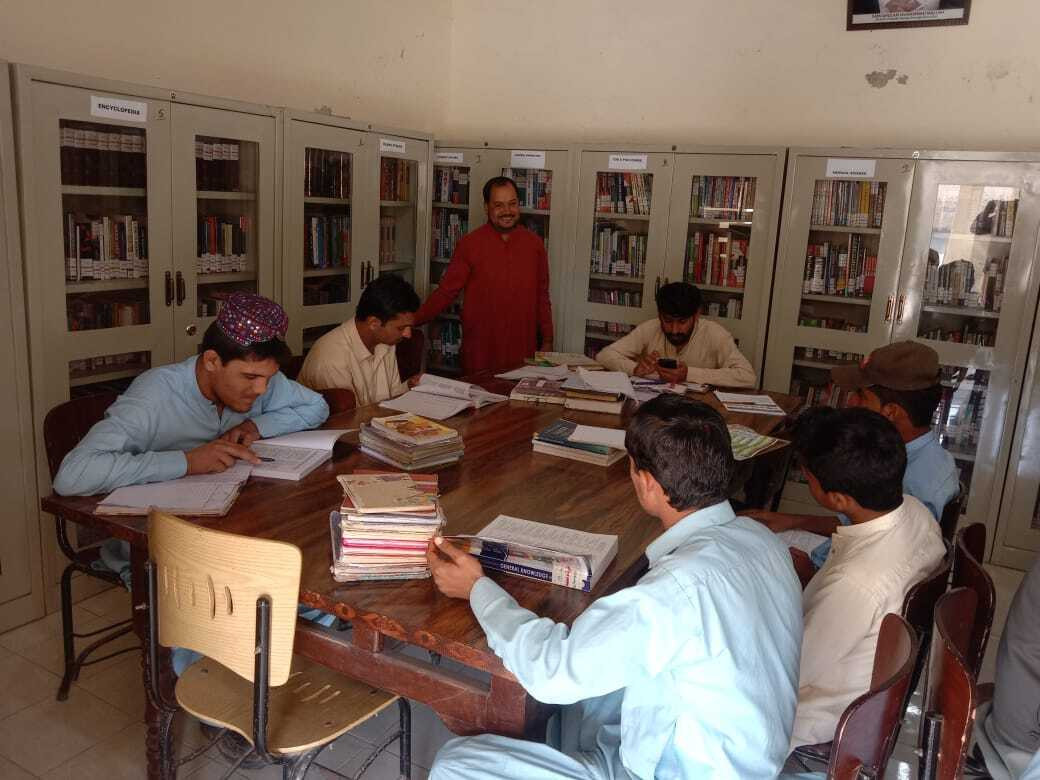 readers engrossed in books at a library in larkana photo express