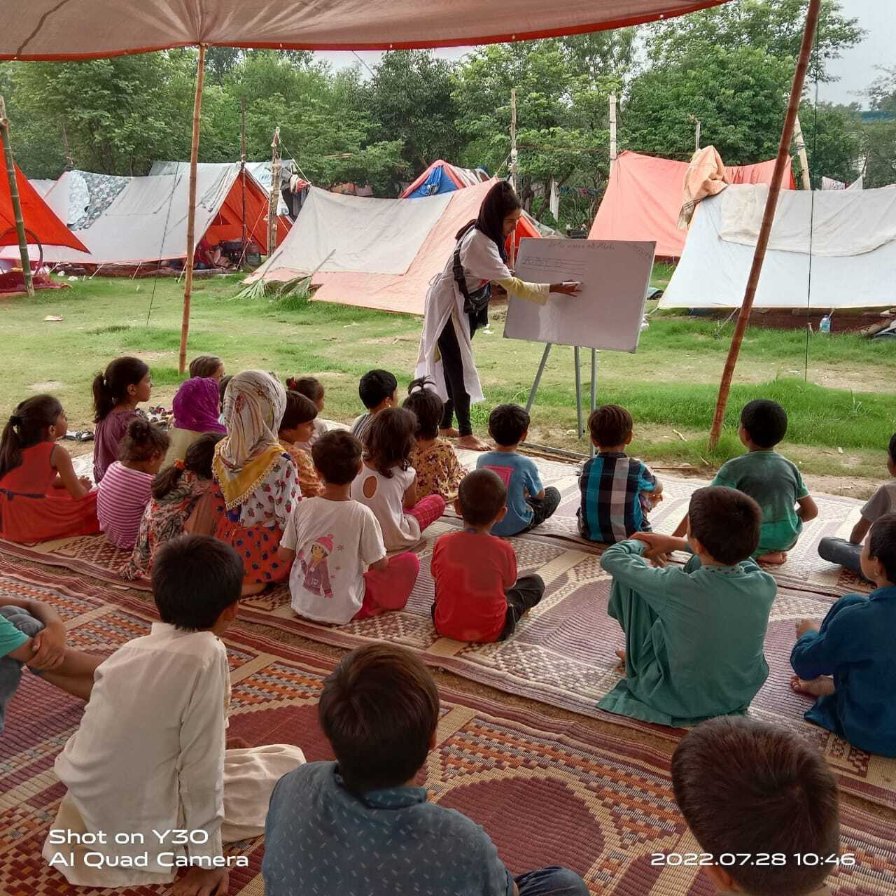 Diana teaching refugee kids in one of the tents