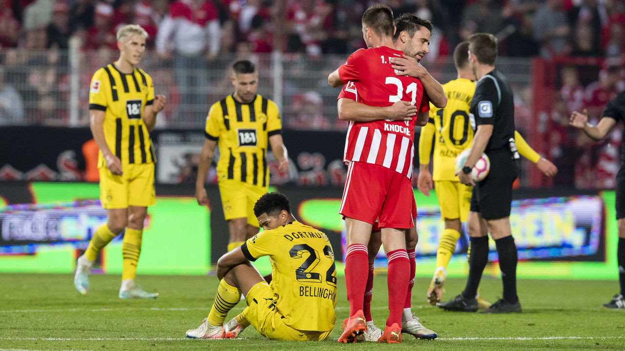 Union stun Dortmund to stay top