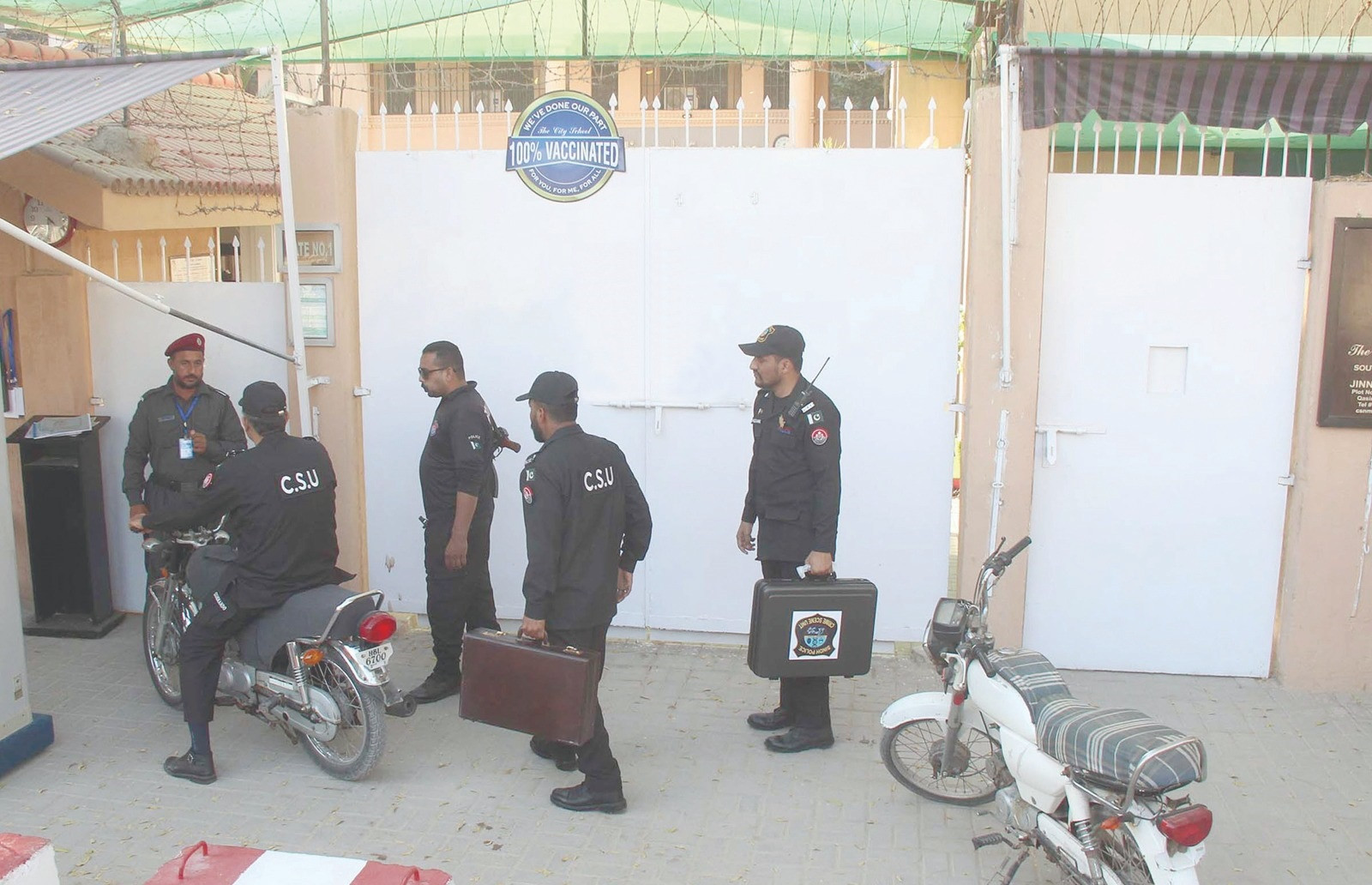 police and crime scene unit officials enter in school for further investigation after a student fall from the third floor balcony of a private school in qasimabad photo express