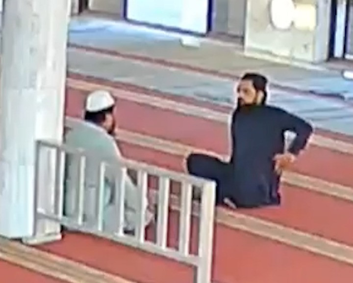 cctv footage shows the suspect parking his motorcycle outside the mosque before sitting down with the muezzin screengrab